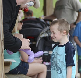 Katie Rickman | The Vindicator.Judson Weingart 6 of Damascus laughs as Mikey D Mamaluke the clown wrote "Judson" on a baloon animal at the 5th annual Carnival  at Damascus Elementary School on May 9, 2015.