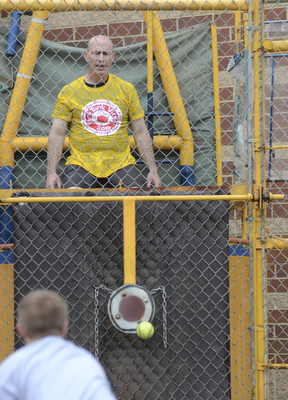 Katie Rickman | The Vindicator.Adam Garloch 10 of Damascus throws a ball and hits the bullseye dropping Chris Tucker, PE teacher at Damascus Elementary School during the 5th annual Carnival on May 9, 2015.