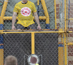 Katie Rickman | The Vindicator.Adam Garloch 10 of Damascus throws a ball and hits the bullseye dropping Chris Tucker, PE teacher at Damascus Elementary School during the 5th annual Carnival on May 9, 2015.