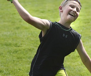 Katie Rickman | The Vindicator.David Sigman 10 of North Benton throws a fast pitch at one of the many games at the 5th annual Carnival  at Damascus Elementary School on May 9, 2015.