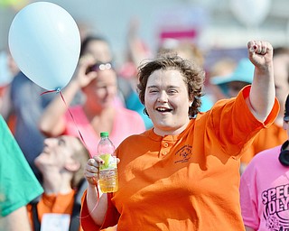Jeff Lange | The Vindicator  MAY 9, 2015 - Christina Eckert of Columbiana County Special Olympics is jubilant as she walks in the parade of athletes prior to the start of Saturday's Special Olympics in Girard.