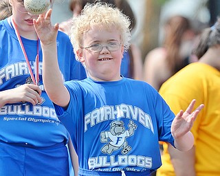 Jeff Lange | The Vindicator  MAY 9, 2015 - Fairhaven's Erin Pressell throws a softball during the women's softball throw, Saturday morning at the Special Olympics in Girard.