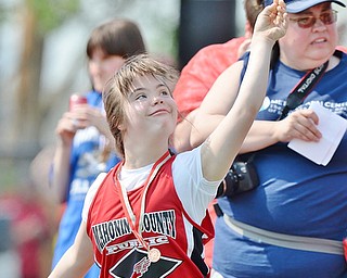 Jeff Lange | The Vindicator  MAY 9, 2015 - Mahoning Public's Christin Murcko releases a throw during the women's softball throw at the Special Olympics at Arrowhead Stadium in Girard, Saturday.