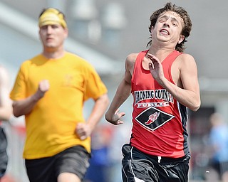 Jeff Lange | The Vindicator  MAY 9, 2015 - Mahoining Public's Jared Ausnehmer (right) takes the lead during the men's 100 meter dash at the Special Olympics in Girard.