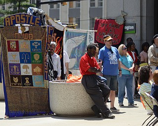 Katie Rickman | The Vindicator.Flags from several local churches are held up during the National Day of Prayer ceremony downtown Youngstown on May 7, 2015.