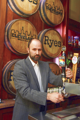 Katie Rickman | The Vindicator.Jeff Kurz, owner of Ryes Craft Beer & Whiskey pours a draft beer at his Youngstown business on May 7, 2015.
