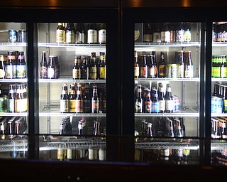 Katie Rickman | The Vindicator.Ryes Craft Beer & Whiskey is one of the newer bars Youngstown, the business is celebrating its first full year May 7, 2015.  Beer lines the cooler wall in one of the bars inside the Youngstown location.
