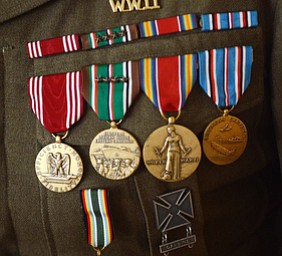 Katie Rickman | The Vindicator.Vince Bellanca of Youngstown was in the 44th Infantry Division in WW2, the medals adorn his uniform.  Bellanca discusses his reaction on VE Day.