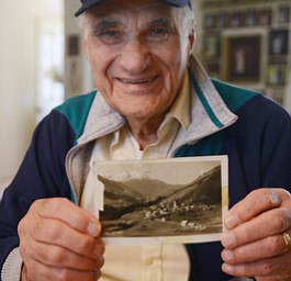 Katie Rickman | The Vindicator.Vince Bellanca of Youngstown was in the 44th Infantry Division in WW2, he holds a post card from 1945 of the town of Arzle, Austria which is where he was on VE Day.  Bellanca discusses his reaction on VE Day.