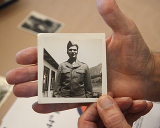 Katie Rickman | The Vindicator.Vince Bellanca of Youngstown was in the 44th Infantry Division in WW2, he holds a photograph taken in approx 1945 in the town of Arzle, Austria which is where he was on VE Day.  Bellanca discusses his reaction on VE Day.