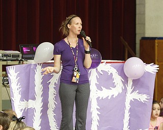        ROBERT K. YOSAY  | THE VINDICATOR..Kendal Daltorio teacher MC'd the event....ÒHope for cancer-free!Ó.Those were one of many chants shouted by Stadium Drive Elementary students as they waved purple pom-poms and banners.