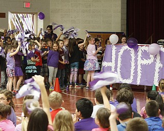        ROBERT K. YOSAY  | THE VINDICATOR..ÒHope for cancer-free!Ó.Those were one of many chants shouted by Stadium Drive Elementary students as they waved purple pom-poms and banners.