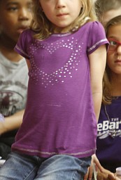        ROBERT K. YOSAY  | THE VINDICATOR..Watching as a video about the Relay for Life  wearing her purple shirt and bow  Kayla Loew  a first grader ..The herbarium at Youngstown State University, featuring a collection of more than 100,000 plant specimens, WAS dedicated in memory of the late Carl F. Chuey, professor of Biology