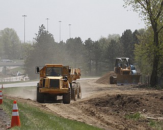        ROBERT K. YOSAY  | THE VINDICATOR..Replacing the water line (24 inch) is Kirila Construction along Rt11 in Canfield as work goes on to the west of the road.. a dump truck makes its way to the replace line..