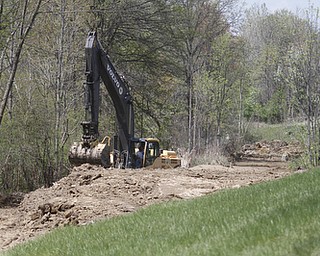       ROBERT K. YOSAY  | THE VINDICATOR..Replacing the water line (24 inch) is Kirila Construction along Rt11 in Canfield as work goes on to the west of the road..
