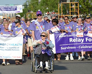 Katie Rickman | The Vindicator.The survivors walk at Warren Relay For Life lead by honorary Queen Rosemary Blicher 92 and honorary King Gary Mower 57 on Friday May 8, 2015.