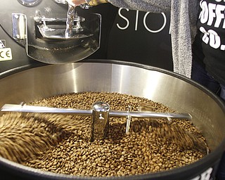        ROBERT K. YOSAY  | THE VINDICATOR..Huge blowers and mixer as the roasted coffee beans must be cooled to room temperature quickly after roasting ..StoneFruit - Canfield coffee shop t Joshua and Jennifer,(Jennifer Rodway, 25, of Liberty, co-owns the business with her husband, Josh Langenheim, 30, also of Liberty.) married couple, who have imported Roasting machines from heavy coffee countries Morrocco and Turkey. They will also have a coffee shop within the Canfield Public Library once it is open..