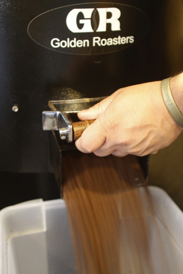        ROBERT K. YOSAY  | THE VINDICATOR..After roasting the beans empty into containers for  at least 24 hours before they can be ground for coffee..StoneFruit - Canfield coffee shop t Joshua and Jennifer,(Jennifer Rodway, 25, of Liberty, co-owns the business with her husband, Josh Langenheim, 30, also of Liberty.) married couple, who have imported Roasting machines from heavy coffee countries Morrocco and Turkey. They will also have a coffee shop within the Canfield Public Library once it is open..