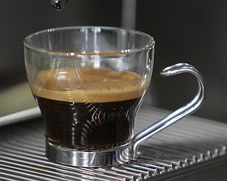       ROBERT K. YOSAY  | THE VINDICATOR..perfectly brewed with the "crema" on top ..StoneFruit - Canfield coffee shop t Joshua and Jennifer,(Jennifer Rodway, 25, of Liberty, co-owns the business with her husband, Josh Langenheim, 30, also of Liberty.) married couple, who have imported Roasting machines from heavy coffee countries Morrocco and Turkey. They will also have a coffee shop within the Canfield Public Library once it is open..