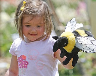        ROBERT K. YOSAY  | THE VINDICATOR..BEE having a good time as MarenEmilia ( ok and yes on capital E) age 3 plays with a bee puppet as part of family fun days .. Fellows Riverside Gardens marked  National Public Gardens Day Friday with a plant sale, in the garden a new event every friday for childen Family Fun Fridays and of course seeing the gardens which are in full spring bloom..