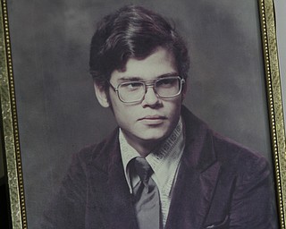        ROBERT K. YOSAY  | THE VINDICATOR..David Popa was killed in a firebombing at an East Side apartment in 1993. his family Charles Jane and David  with his photo ( high school).