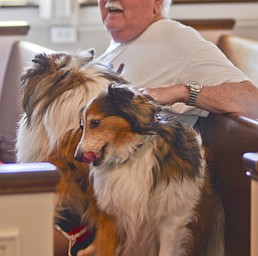 Katie Rickman | The Vindicator.Bob Maruschak of Poland sits the pew next to his dogs Mikey and Mitzie as he sings "All Creatures Of Our God and King" during theannual Animal Blessing at St. James the Episcopal Church in Boardman on Sunday May 10, 2015.