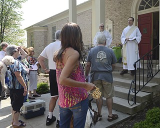 Katie Rickman | The Vindicator.Rev. John Wigle on left and Rev. Shawn Dickerson stand on the church steps and welcome the pets and their owners to the annual Animal Blessing at St. James the Episcopal Church in Boardman on Sunday May 10, 2015.