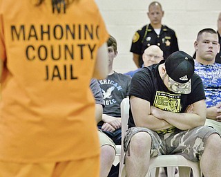 Jeff Lange | The Vindicator  MAY 7, 2015 - Jackson Milton senior Tyler Thorn hangs his head as he listens to the stories of several inmates at the Mahoning County Jail, Thursday morning.