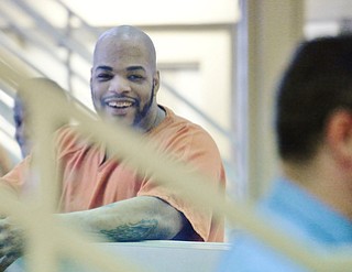 Jeff Lange | The Vindicator  MAY 7, 2015 - An inmate looks back and laughs as students from Jackson Milton High School tour the Mahoning County Jail, Thursday morning in Youngstown.