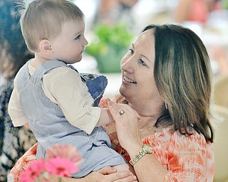 Jeff Lange | The Vindicator  MAY 10, 2015 - Patti Mosure of Canfield (right) plays with her grandson before getting a plate of food during the Mothers Day brunch at Fellows Riverside Gardens in Youngstown, Sunday morning.