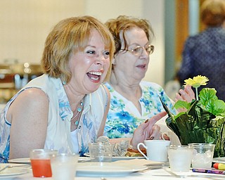 Jeff Lange | The Vindicator  MAY 10, 2015 - Michele Philbin of Howland (left) enjoys a moment of laughter with her mother Nita Szallay during Sunday's Mothers Day brunch at Fellows Riverside Gardens in Youngstown.
