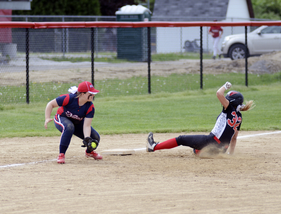 Katie Rickman | The Vindicator.Canfield's Kara Rothbauer (32 )slides in safe to third base dispite Girard's Alexandira Blaine (10) during the third inning against Girard at Canfield High School on May 12, 2015.