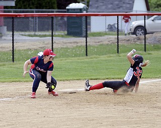 Katie Rickman | The Vindicator.Canfield's Kara Rothbauer (32 )slides in safe to third base dispite Girard's Alexandira Blaine (10) during the third inning against Girard at Canfield High School on May 12, 2015.