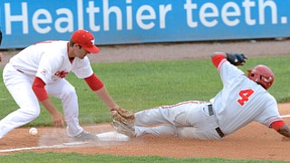 Jeff Lange | The Vindicator  MAY 12, 2015 - OSU's Ronnie Dawson (4) slides safely into third as Youngstown's third baseman Matt Sullivan drops the ball in the third inning of Tuesday night's game at Eastwood Field.