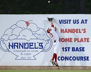 Jeff Lange | The Vindicator  MAY 12, 2015 - Youngstown centerfielder Frank Califano stretches in attempt to catch a Pat Porter of OSU's two run homer in the eighth inning of Tuesday night's game at Eastwood Field.