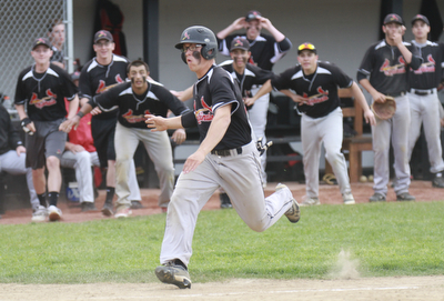 William D Lewis the vindicator Canfield'sMike Sebes(22) heads toward the plate to score winning running in game with niles thursday 5-14 at Canfield.