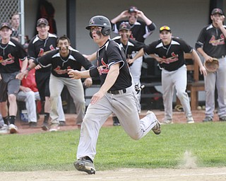 William D Lewis the vindicator Canfield'sMike Sebes(22) heads toward the plate to score winning running in game with niles thursday 5-14 at Canfield.