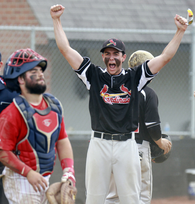 William D Lewis the vindicator Canfield's David shaffer reacts after Mike Sebes scored winning running in game with niles thursday 5-14 at Canfield. at left is Niles catcher Cameron Carson (7).