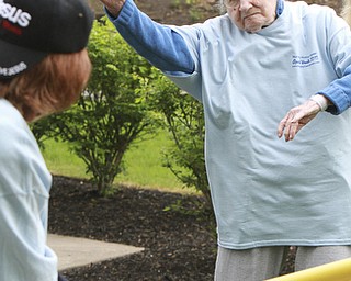 William D Lewis The Vindicator  Margie Mills, 91, a residnet of Beeghley Oaks Nursing Home in Boardman pitches a baseball 5-15-15. Members of the Struthers HS baseball team visited the facility as part of National Nursing Home Week  and played a few innings with the residents.