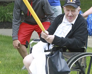 William D Lewis The Vindicator  Tom Drummond, 91, a resident of Beeghley Oaks Nursing Home in Boardman plays baseball 5-15-15. JMembers of the Struthers HS baseball team visited the facility as part of National Nursing Home Week  and played a few innings with the residents..Struthers 11th grade baseplayer Jake Kriebel catches during the game.