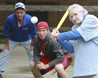 William D Lewis The Vindicator  Margie Mills, 91, a resident of Beeghley Oaks Nursing Home in Boardman swings at a baseball 5-15-15. Members of the Struthers HS baseball team visited the facility as part of National Nursing Home Week  and played a few innings with the residents. Struthers 11th grade bball team member Jake Kriebel served as catcher. At left is Pat Carano whose wife works at Beeghley.