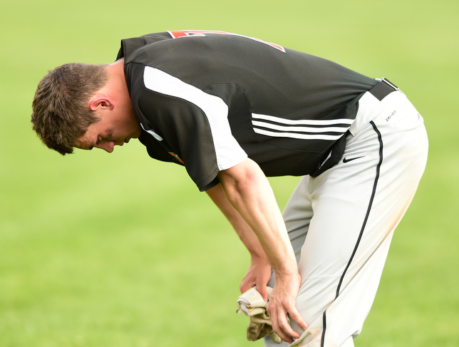 NEW MIDDLETOWN, OHIO - MAY 15, 2015: Ryan Kohler #7 of Springfield hangs his head in the outfield after a game Friday afternoon at Springfield High School. (Photo by David Dermer/Youngstown Vindicator)