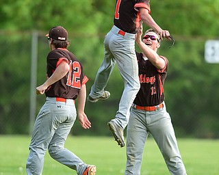 NEW MIDDLETOWN, OHIO - MAY 15, 2015: (LtoR) Reid Frye #12, JR Davis #1, and Trevor Kimmel #11 of East Palestine celebrate int he outfield after a game Friday afternoon at Springfield High School. (Photo by David Dermer/Youngstown Vindicator)