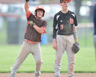 NEW MIDDLETOWN, OHIO - MAY 15, 2015: Base runner Josh Fristik #4 celebrates after hitting a RBI double in the top of the 5th inning during a game Friday afternoon at Springfield High School. (Photo by David Dermer/Youngstown Vindicator)