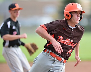 NEW MIDDLETOWN, OHIO - MAY 15, 2015: Reid Frye #12 of East Palestine rounds third base to head home and score a run in the top of the 5th inning during a game Friday afternoon at Springfield High School. (Photo by David Dermer/Youngstown Vindicator)