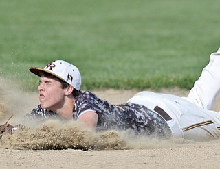 Jeff Lange | The Vindicator  MAY 15, 2015 - South Range shortstop Brandon Youngs dives in attempt to catch a ground ball to left field in the top of the sixth inning of Friday's game against Columbiana at South Range High School.