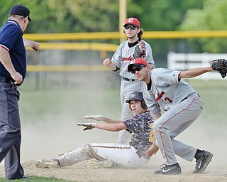 Jeff Lange | The Vindicator  MAY 15, 2015 - South Range base runner Brandon Youngs (bottom) motions that he is safe as the umpire calls him out while Clippers infielders Devin Rice (7) and Matt Weidner look on in the bottom of the fifth inning of their Friday afternoon game at South Range High School.