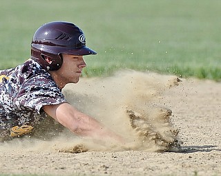 Jeff Lange | The Vindicator  MAY 15, 2015 - South Range base runner Anthony Ritter dives to beat the throw back to second base in the bottom of the third inning against the Columbiana Clippers, Friday afternoon.