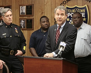       ROBERT K. YOSAY  | THE VINDICATOR..U.S. Sen. Sherrod Brown, a Democrat of Cleveland, met with local law enforcement today to discuss the importance of federal funds to maintain safety..The Byrne Justice Assistance Grant (Byrne JAG) program has provided more than $15 million to help Ohio police departments.-those in attendance - Brown at mike- YPD chief Robin Lees- Guy Burney- Rev Lewis Macklin-