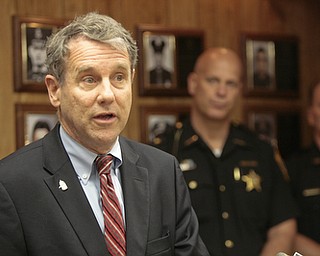        ROBERT K. YOSAY  | THE VINDICATOR..U.S. Sen. Sherrod Brown, a Democrat of Cleveland, met with local law enforcement today to discuss the importance of federal funds to maintain safety..The Byrne Justice Assistance Grant (Byrne JAG) program has provided more than $15 million to help Ohio police departments.-those in attendance - Brown at mike- - Sheriff Jerry Greene-